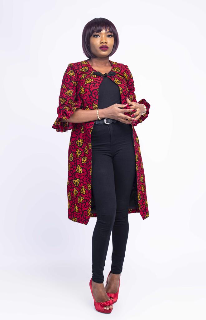 Product image - Bulk produce option available.Want to be trendy and gorgeous? This red long African jacket is what you need. You can pair with a pant, jeans, leggings or pencil dress.  It has a lovely sleeve and black button at top center front to enhance your beauty. Buy this Ify red African coat dress for elegance look.