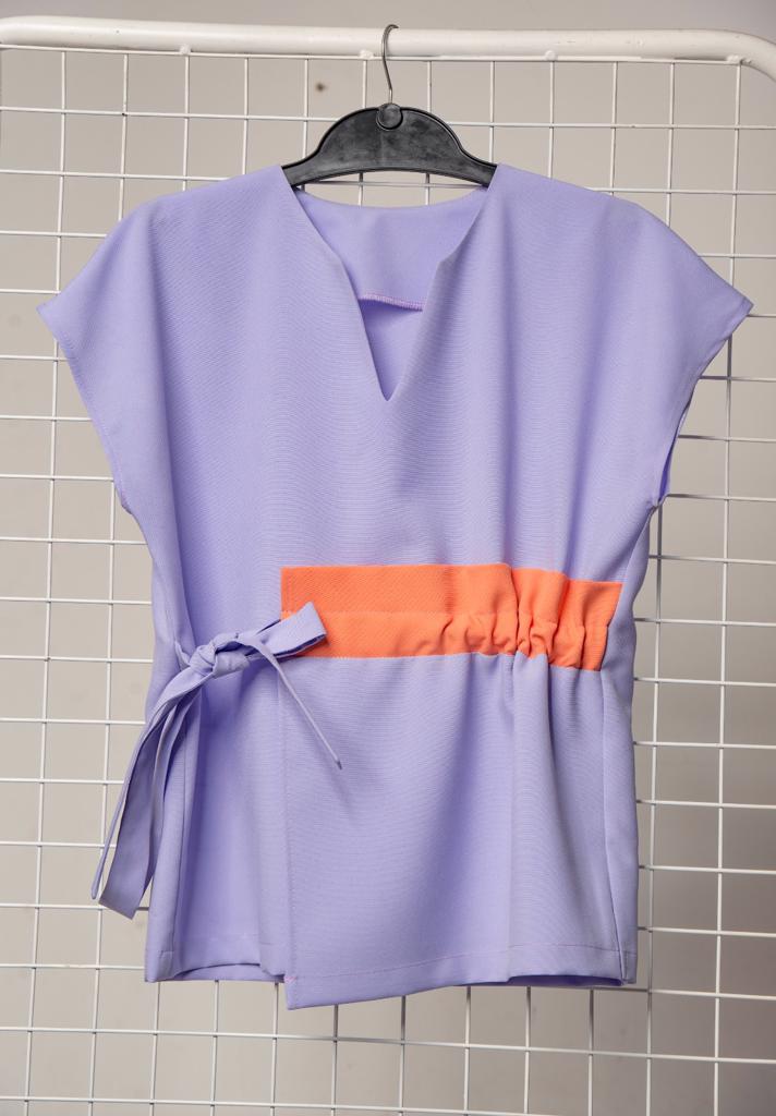 Product image - Maternity friendly adjustable scrub top. Made from good quality, easy to care fabrics. Available in various dark or bright colours with or without contrast. Sizes range from 28 to 50.