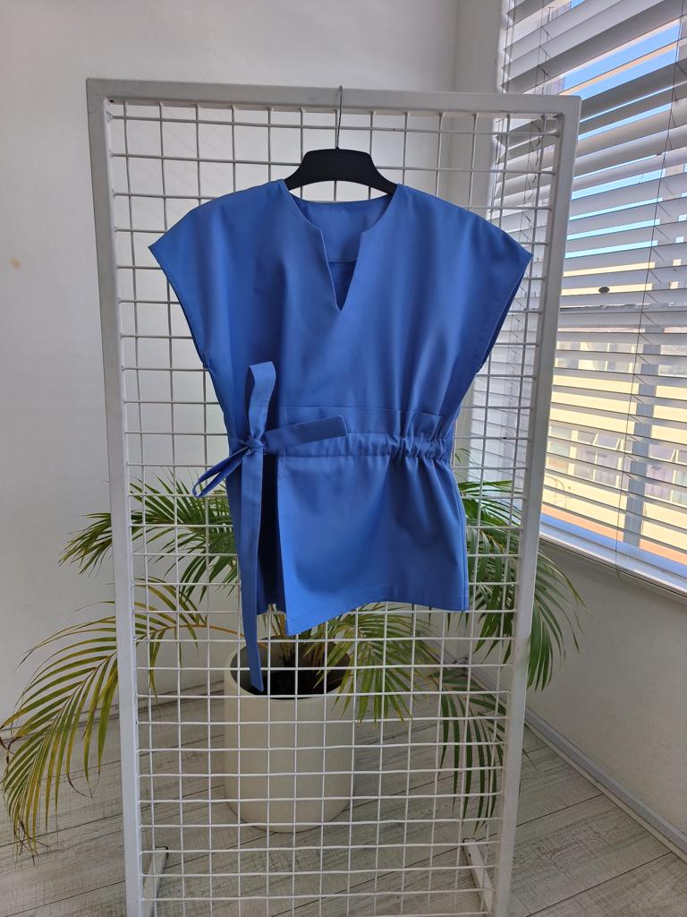 Product image - Maternity friendly adjustable scrub top. Made from superior quality 65/35 poly cotton twill fabric. Available in various colours. Sizes range from 28 to 50.