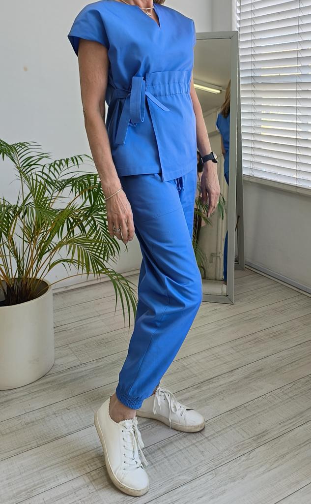 Product image - Maternity friendly adjustable scrub top. Made from superior quality 65/35 poly cotton twill fabric. Available in various colours. Sizes range from 28 to 50.