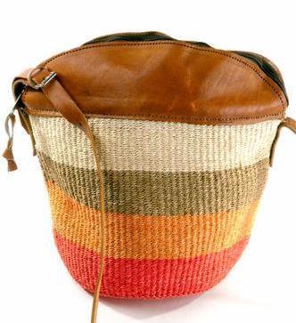 Product image - W excel at weaving beautiful, useful African baskets from sisal, raffia, doum palm, banana fiber and water hyacinth. Using coil and plaiting techniques, weavers craft baskets that double as art.